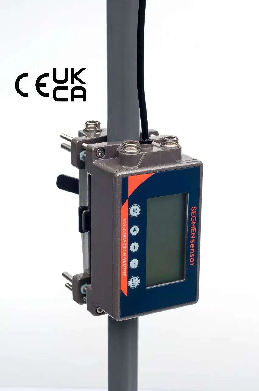 SEGMENsensor U12 compact clamp-on ultrasonic flow meter clamped on a vertical pipe, with CE and UKCA marks